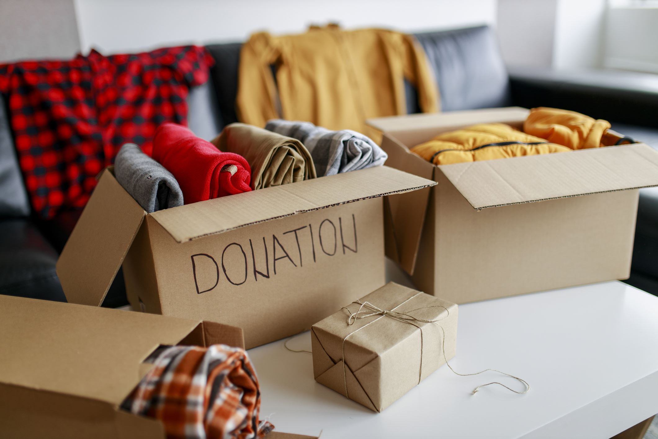 box labeled donation with clothes inside